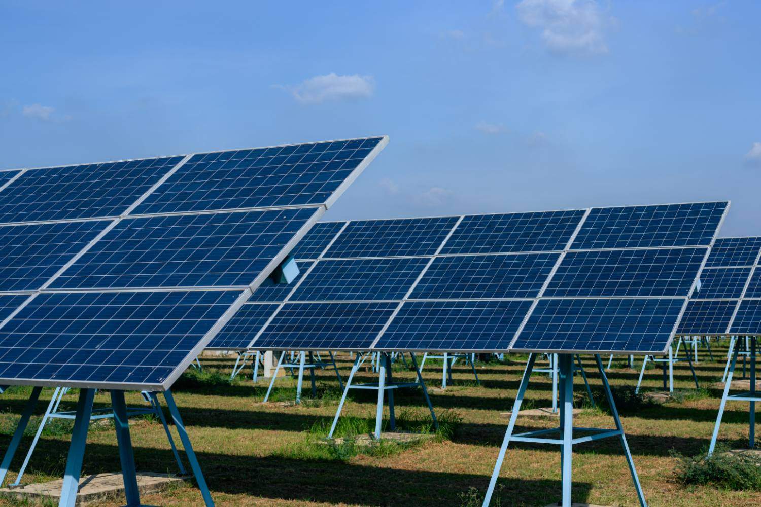 Technician installing solar panels on a residential rooftop in Peshawar for sustainable energy solutions